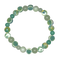 Green beaded bracelet on a white background